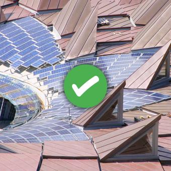Solar panels on the roof of the Core building with an overlaid tick